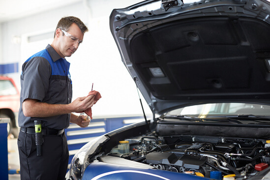 A mechanic working on a car
