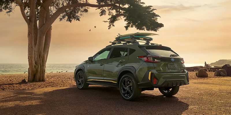 2026 Subaru CROSSTREK parked beside tree